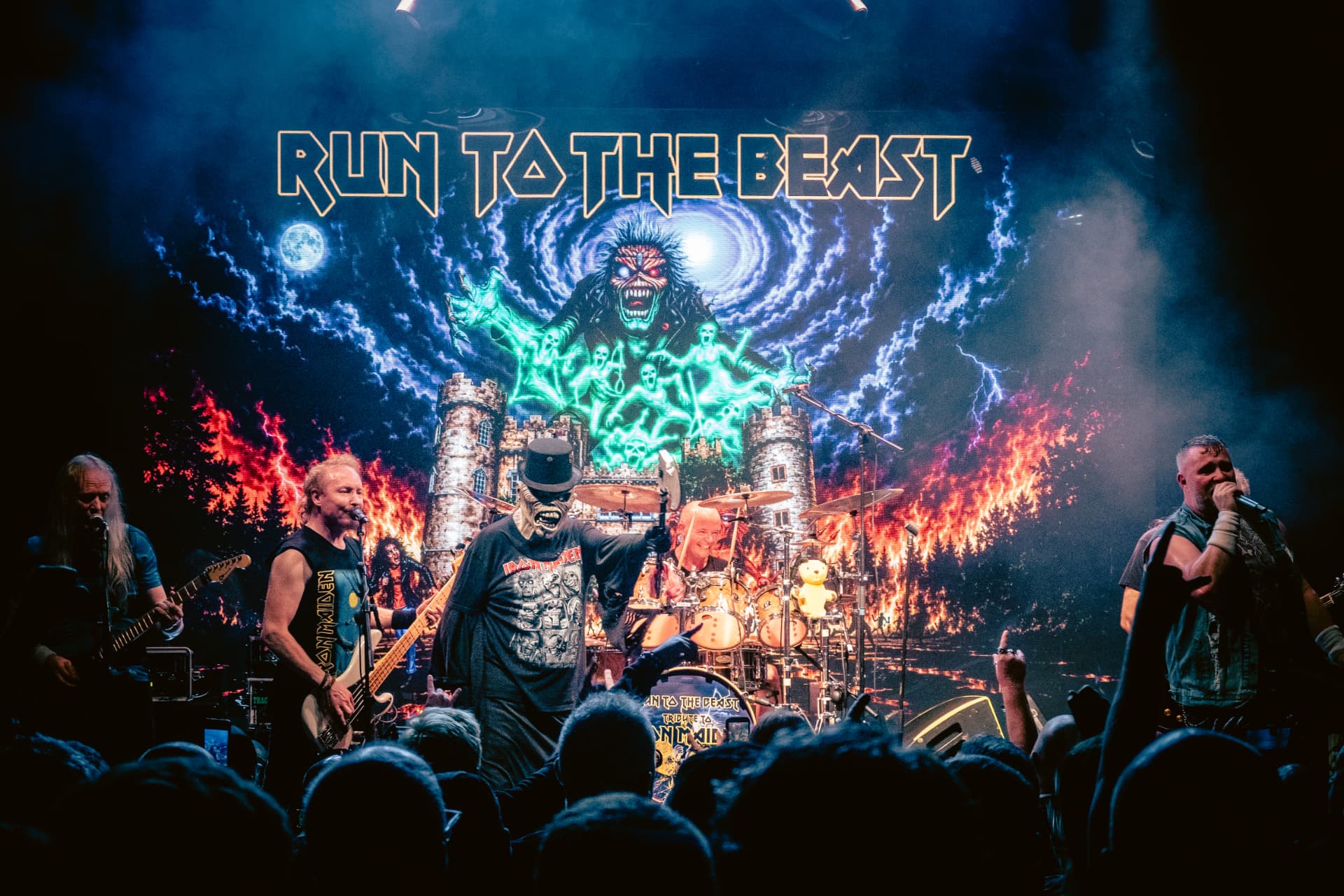 Run to the Beast performing at The Button Factory, Dublin — the band and masked character across the full stage